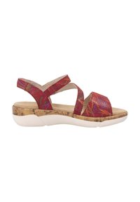 Sandales texturées rouges avec une semelle en liège, présentant un design de bride croisées et un semelle intérieure rembourrée, complétées par une semelle extérieure blanche.