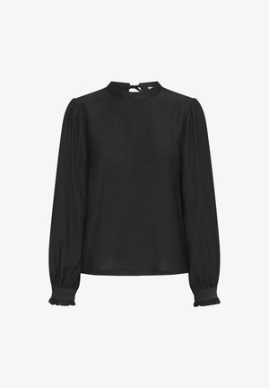 Blouse noire à manches longues avec un col montant, des poignets à volants et un détail de lien au dos, fabriquée en tissu léger texturé.