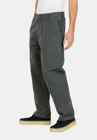 Dark gray cargo pants with a relaxed fit, featuring side pockets and a secure waistband. Material appears durable with a smooth texture.