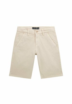 Pantaloni corti beige con taglio dritto, realizzati in morbido tessuto di cotone. Presentano una chiusura con zip, due tasche frontali e un'etichetta con logo sulla vita.