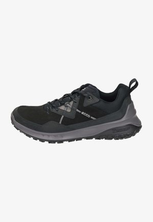 Schwarzer Wanderschuh mit strukturiertem Obermaterial, grauen Akzenten und Schnürsystem. Verfügt über eine langlebige Laufsohle mit robustem Profil.