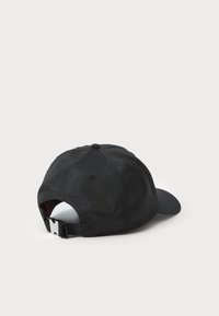 Black baseball cap with a smooth texture, curved brim, and adjustable strap at the back. The fabric appears lightweight and durable.