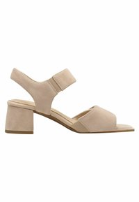Beige Wildledersandale mit Blockabsatz, offener Zehenpartie und einem Knöchelriemen mit elastischen Einsätzen für einen sicheren Sitz. Flache Sohle und genähte Akzente.