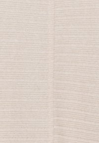 Un tissu beige clair avec une texture côtelée subtile, présentant des lignes horizontales créant un design doux et structuré.