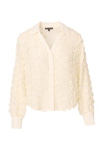 White blouse with a textured floral pattern, featuring a button-down front, long sleeves, and a collared neckline. Soft fabric.