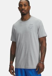 Gray cotton t-shirt with a crew neckline, featuring "Under Armour" logo and world map in a lighter shade on the left chest.