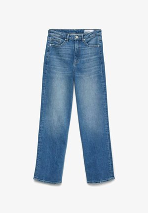 Jean denim bleu à jambe droite avec fermeture avant à boutons et zip, poches avant et poche monnaie, et légère décoloration sur les cuisses.