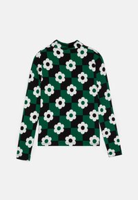 Langermet topp med et svart og grønt rutemønster med hvite blomster. Laget av stretchy stoff, med høy hals og figurnær passform.