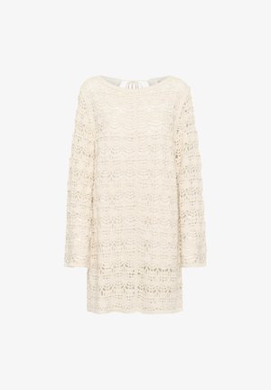 Čipkový top v off-white farbe s dlhými rukávmi, s vlnkovaným vzorom a uväzovaním na zadnej strane. Textúrovaný, otvorený pletený dizajn.