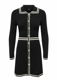 Crna dugačka pletena haljina s dugim rukavima i bijelim obrubom, s prednjim kopčanjem na dugmad, valovitim rubovima i ovratnikom u mornarskom stilu.