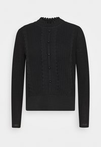 Pull en maille noir à manches longues avec bords festonnés, devant boutonné, et panneaux en maille torsadée verticale texturée.