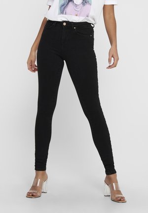 Jeans skinny neri a vita alta realizzati in denim con una texture liscia, dotati di tasche frontali e accessori in tonalità oro.