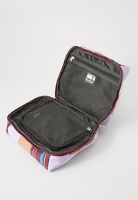 Zippered bag featuring purple, brown, and blue stripes. Interior has a mesh pocket and a padded compartment for organization.