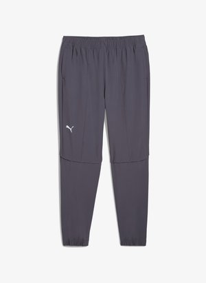Pantaloni sportivi grigi con cintura elastica, tasche laterali con zip e un logo bianco. Realizzati in tessuto leggero e liscio.