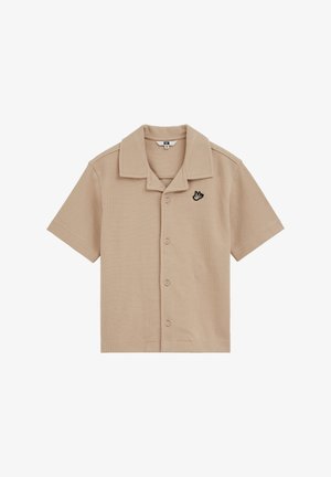 Beiges kurzärmliges Hemd mit Knopfleiste, spitzem Kragen und einem kleinen schwarz-weißen gestickten Vogel auf der linken Brustseite.
