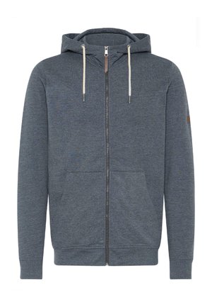Siva zip-up kapuca z obloženjem, nastavljivimi vrvicami, sprednjimi žepi in rebrastimi manšeti. Ponuja majhen usnjen logotip kot dekoracijo.