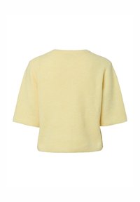 Short-sleeve top in soft, ribbed yellow fabric. Relaxed fit with a rounded neckline and no visible closures. Simple, textured pattern.