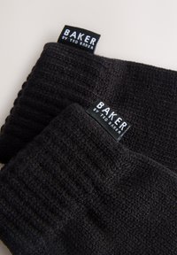 Black knitted hats with a textured pattern, featuring tags reading "BAKER by TED BAKER." Soft, warm material and a classic shape.