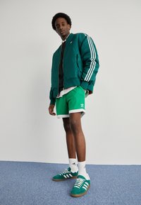 adidas Originals MOCK EYELET - Träningsbyxor - green