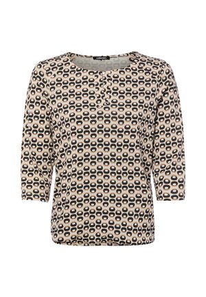 Beige Bluse mit schwarz-weißem Ovalmuster, rundem Ausschnitt, dreiviertel Ärmeln und kleinem Falten-Detail vorne in der Mitte.