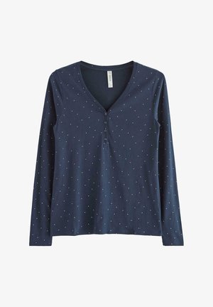 Chemise à manches longues bleu marine avec un col V, ornée de petits motifs à pois blancs, d'une patte de boutonnage et d'un tissu doux et léger.