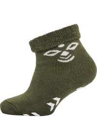 Grön ankelstrumpa med ribbat mönster, med en vikbar mudd och vita mönsteraccenter på sidan. Mjukt material med halkskydd.