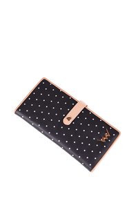 Black wallet with white polka dots, tan leather trim, and a snap closure. Features a gold logo and smooth texture. Rectangular shape.