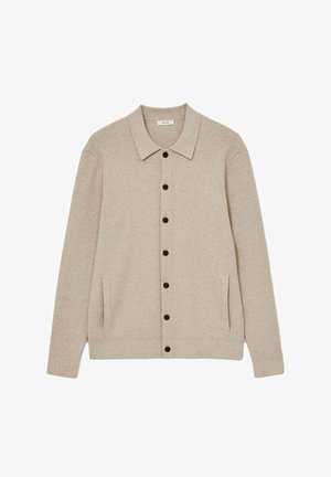 Beez kardigan, millel on kaelus, seitse musta nuppu, kaks küljetaskut ja soonikservad. Pehme tekstuur ja vabalt langev lõige.