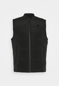 Gilet senza maniche trapuntato nero con zip frontale, tasche laterali con zip e colletto a costine, esposto su sfondo bianco semplice.