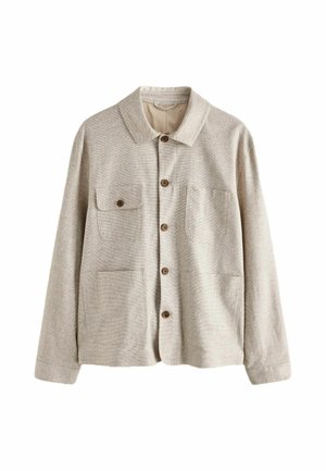 Beige button-up jacket with collar and four front pockets, one with a buttoned flap, made from textured fabric.