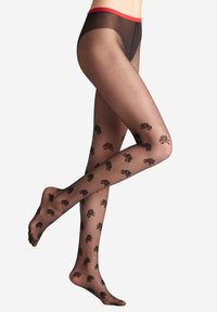 Collant neri trasparenti con un motivo floreale, caratterizzati da una vita elasticizzata rossa, una texture a coste e disegni floreali lungo le gambe.
