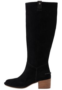 Black suede knee-high boot with a block heel, rounded toe, stitched detailing, and a strap accent near the ankle.