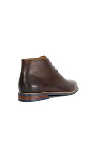 Brown leather ankle boot with a smooth texture, rounded toe, and subtle stitching details. Features a layered sole with blue accents.