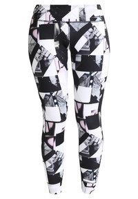 Svarta och vita leggings med ett geometriskt mönster som innehåller fragment av fotografier i olika former och storlekar, gjorda av stretchigt tyg.