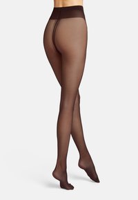 Gennemsigtige brune strømpebukser med en glat tekstur, høj talje og åben rygdesgin, der strækker sig ned til anklen med en sømløs afslutning.