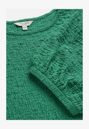 Grünes, strukturiertes Oberteil aus Stoff mit kurzem Ärmel, rundem Ausschnitt und sichtbarem Cellbes of Sweden Größenlabel 38/40.