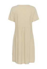 Abito corto beige chiaro a maniche corte con scollo rotondo, schiena arricciata e una silhouette A-line ampia. Realizzato in un tessuto morbido e testurizzato.