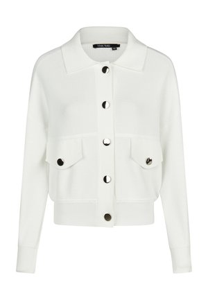 White knitted cardigan with large silver buttons down front and on two flap chest pockets, long sleeves, and a collar.