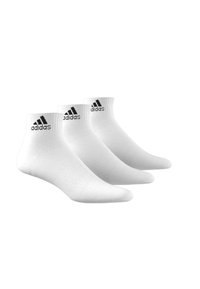 White ankle socks with ribbed cuffs, featuring black adidas logo accents. Set of three pairs, smooth texture and athletic design.