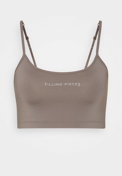 Top cropped castanho elástico com alças ajustáveis e logo impresso "Filling Pieces". Textura suave e design ajustado.