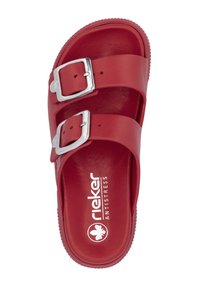 Red slide sandal made of smooth synthetic material, featuring two adjustable straps with silver buckles. Text "rieker ANTISTRESS" is visible.