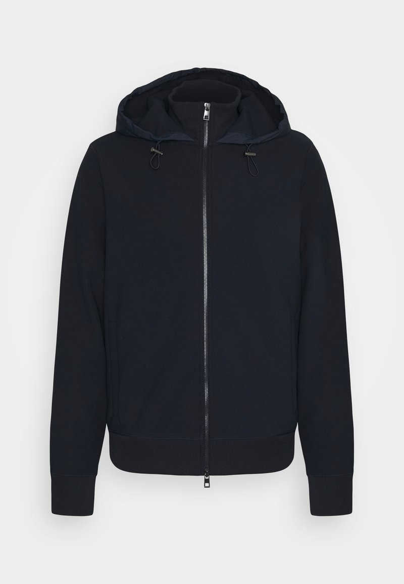 Sweat à capuche zippé bleu marine en matière douce, avec capuche à cordon, fermeture éclair à l'avant, poignets et ourlet côtelés. Aucun motif notable.