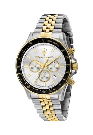Orologio cronografo con quadrante argento, dettagli dorati, cassa in acciaio inossidabile e bracciale metallico bicolore. Presenta tachimetro e più quadranti.