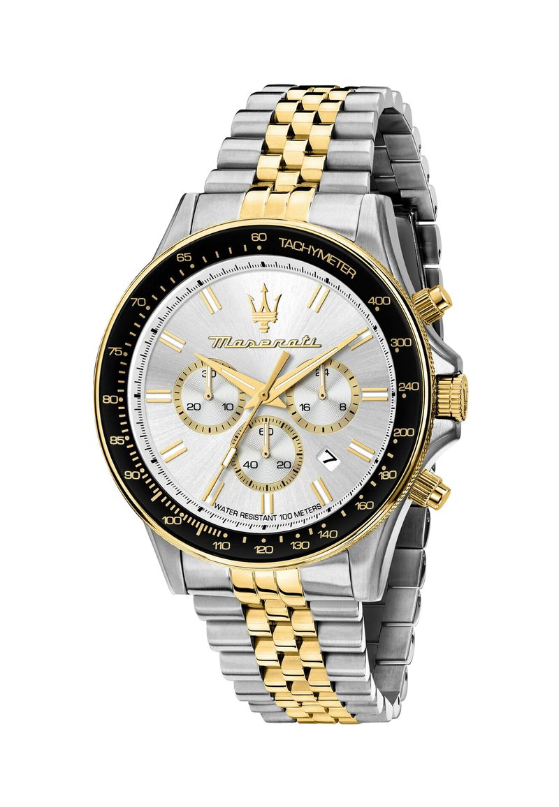Orologio cronografo con quadrante argento, dettagli dorati, cassa in acciaio inossidabile e bracciale metallico bicolore. Presenta tachimetro e più quadranti.