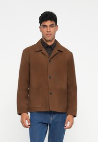Brown, structured jacket made of a soft fabric. Features a notched collar, front button closure, and two front patch pockets.