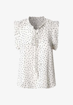 Blusa blanca con mangas cortas acampanadas, que presenta un lazo con borlas en el escote y un patrón de lunas de color marino. Tejido texturizado.