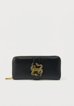 Black leather zip-around wallet with gold snake-shaped clasp and "Just Cavalli" logo on front.