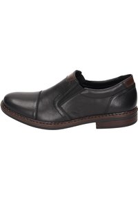 Black leather slip-on shoe featuring a rounded toe, contrasting brown accent on the heel, and decorative stitching along the sides.