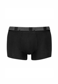 Zwarte boxershorts gemaakt van zachte katoen met een gladde oppervlakte, met een merkband in witte letters.