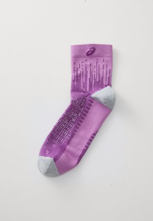 Purple athletic sock with a gradient design, featuring light gray heel and toe sections. Textured patterns in pink and white enhance grip.